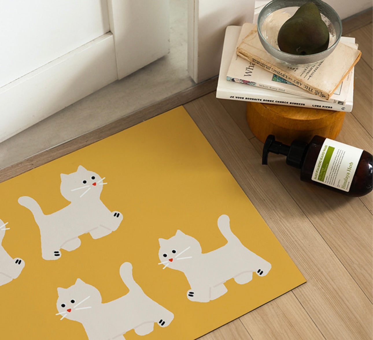 Cat steps Mat
