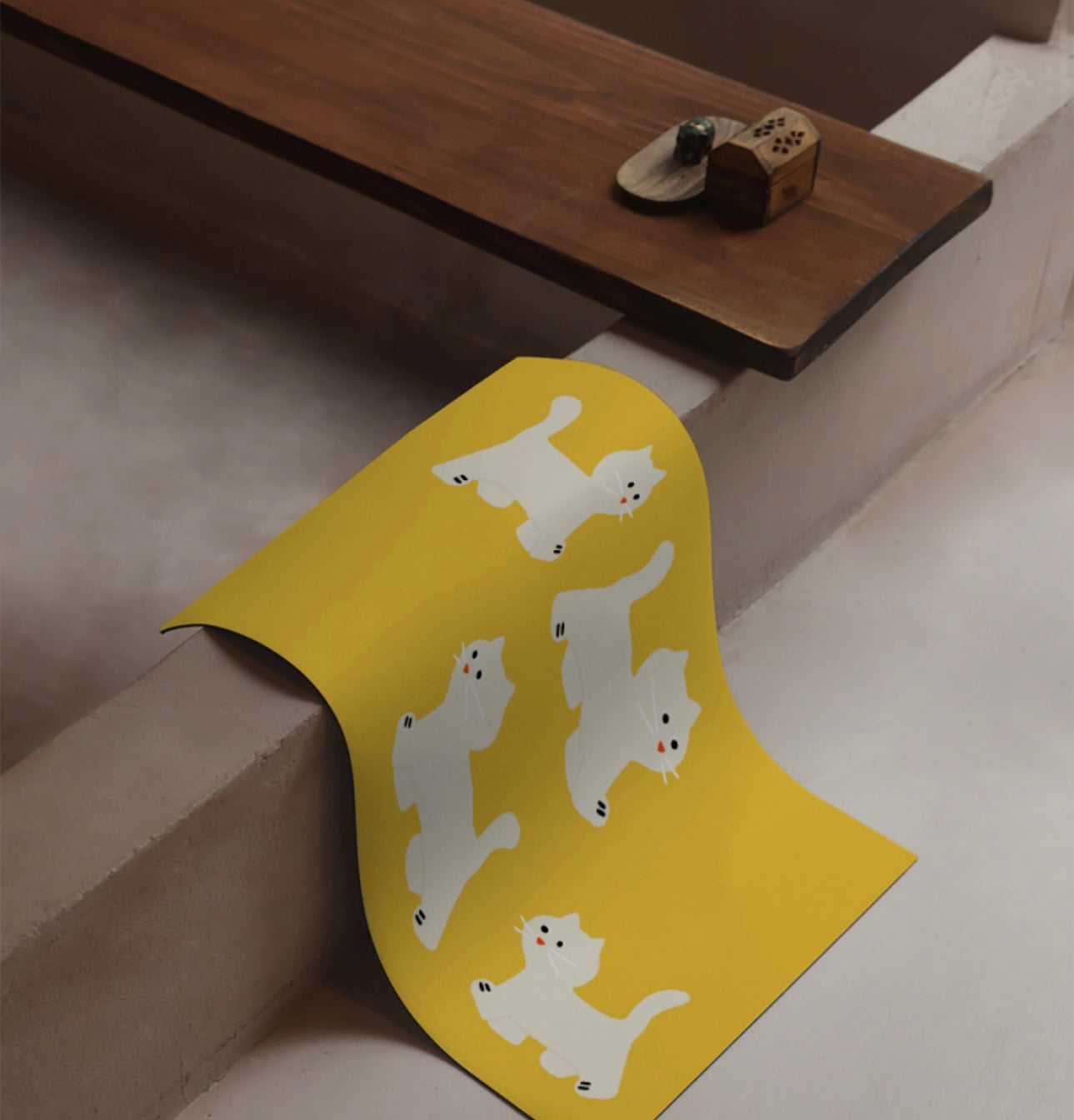 Cat steps Mat