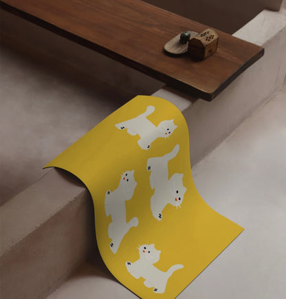 Cat steps Mat
