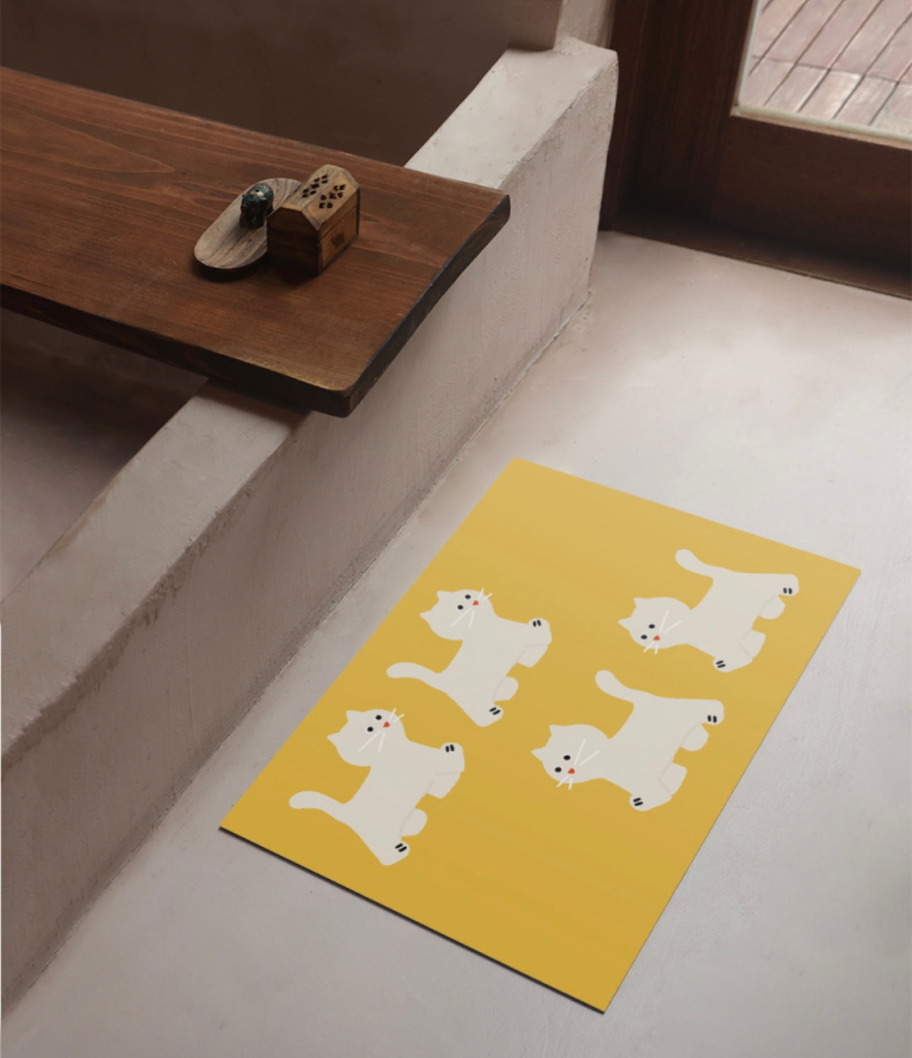 Cat steps Mat