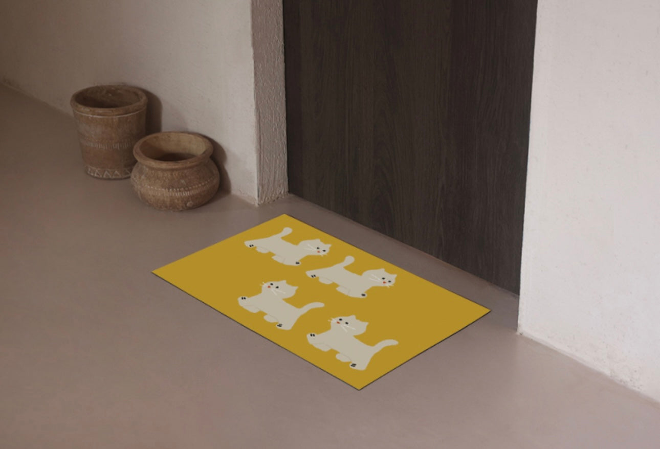 Cat steps Mat